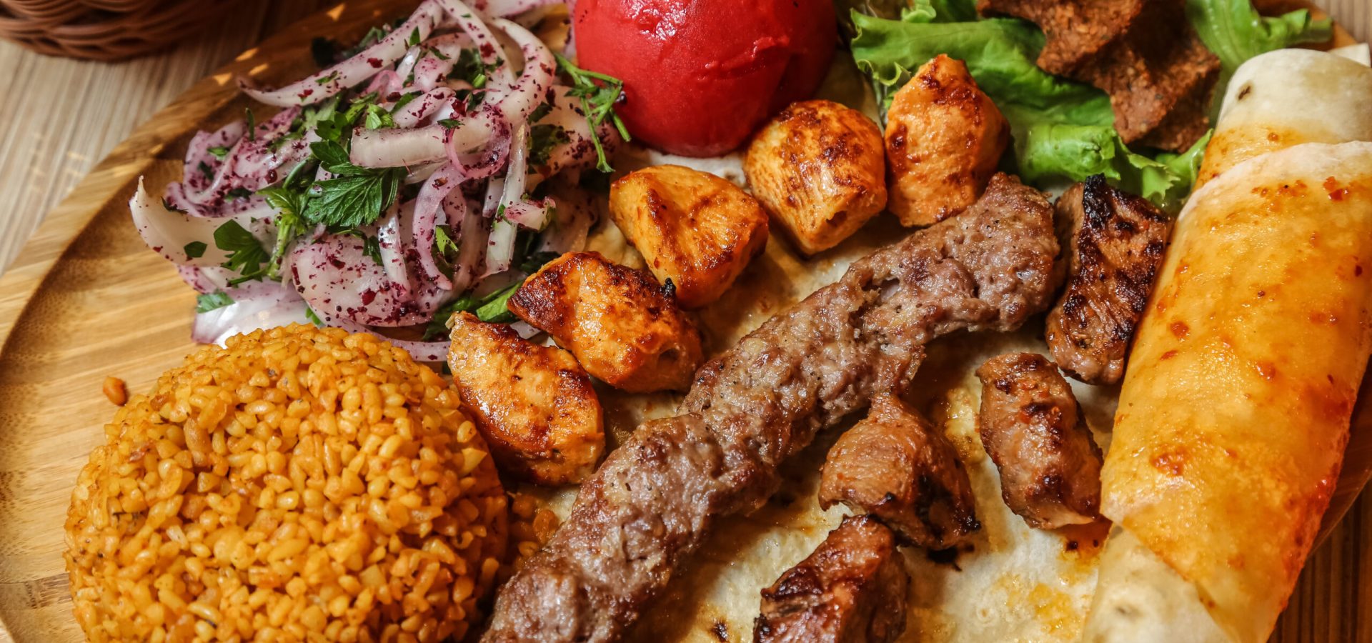 top view kebab mix with bulgur onion and pita bread with vegetables on a stand